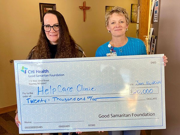 Lisa Guthrie, RN, (left) executive director, HelpCare Clinic received a Community Health Improvement Grant check for $20,000 from Kimber Bonner, RN, (right) vice president of patient care services, CHI Health Good Samaritan.