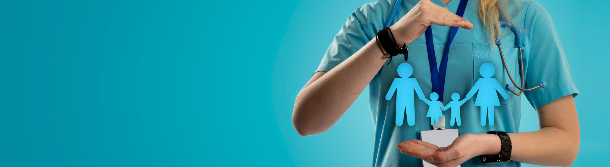 Medical provider hands with paper cut out of family