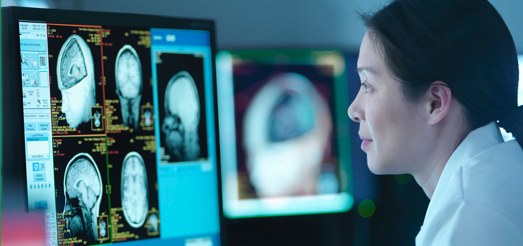 Technician reviewing brain scans