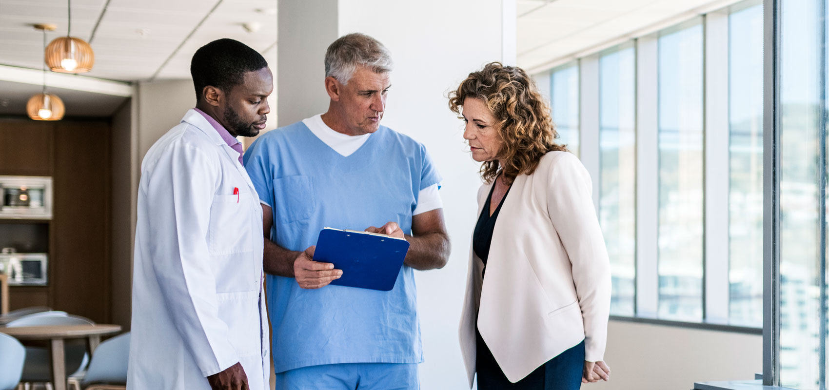 Three medical providers talking