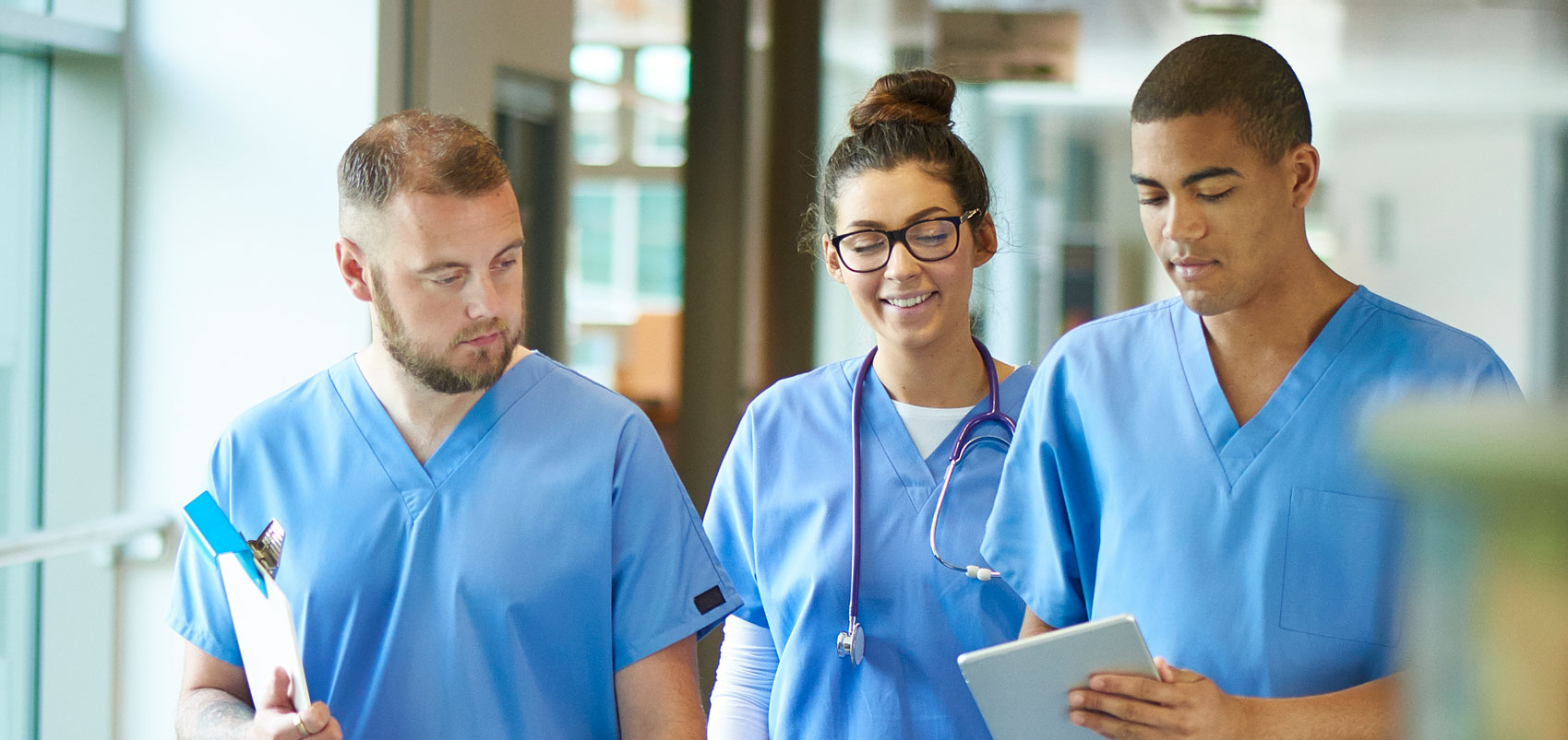 Medical providers walking down hall