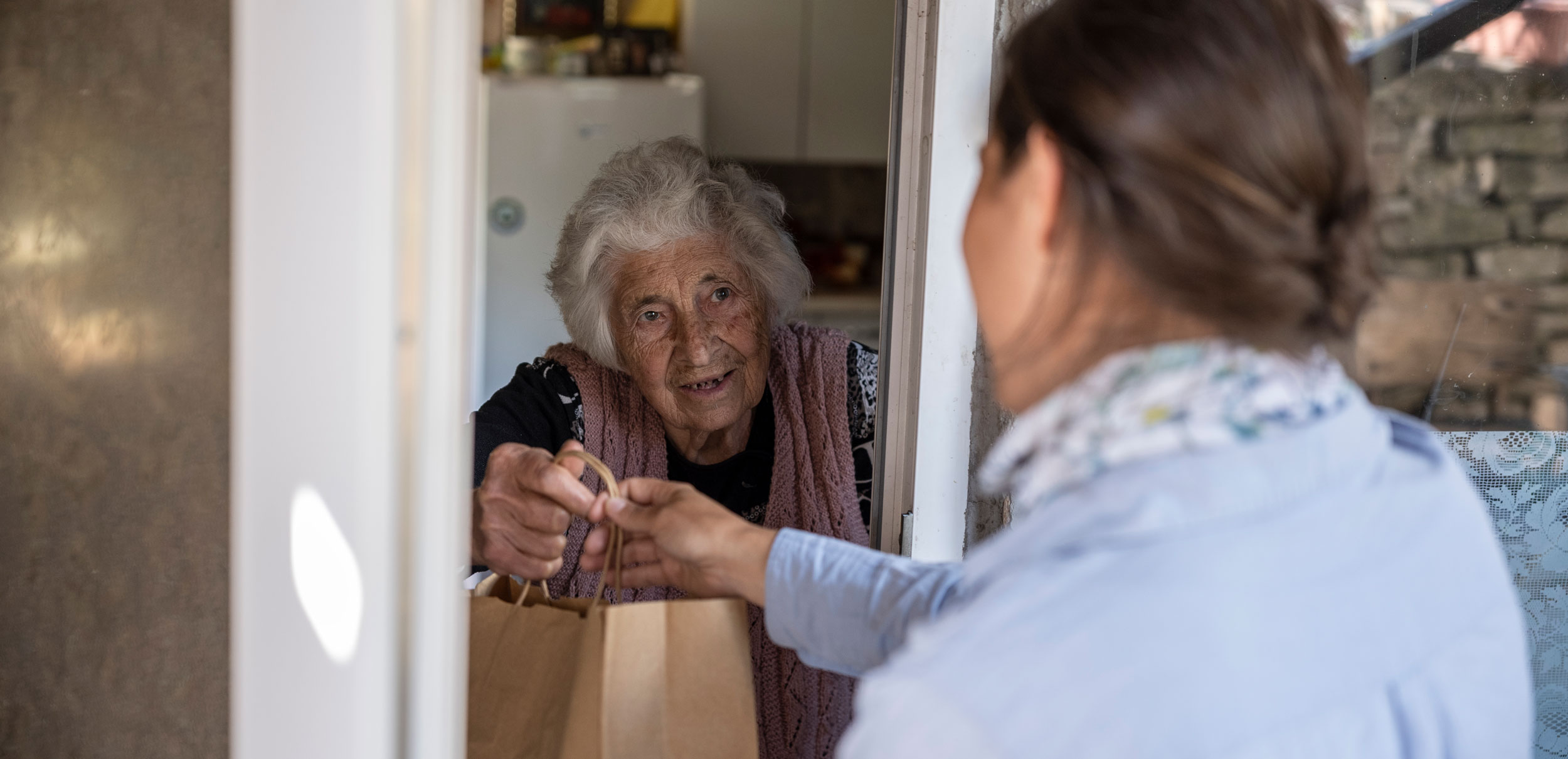 Food being delivered to an elderly woman