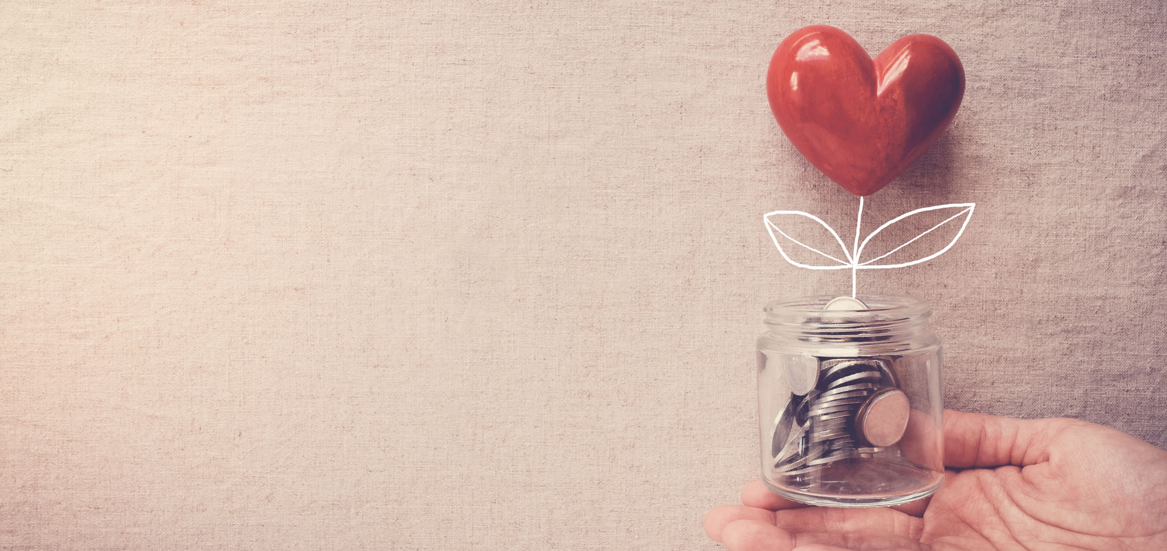 Heart on top of jar of coins