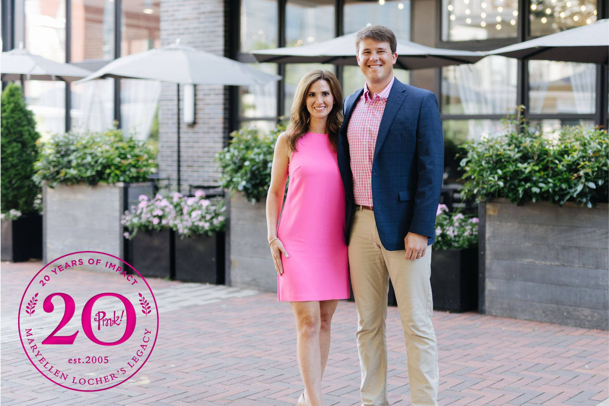 A young couple in front of an outdoor venue