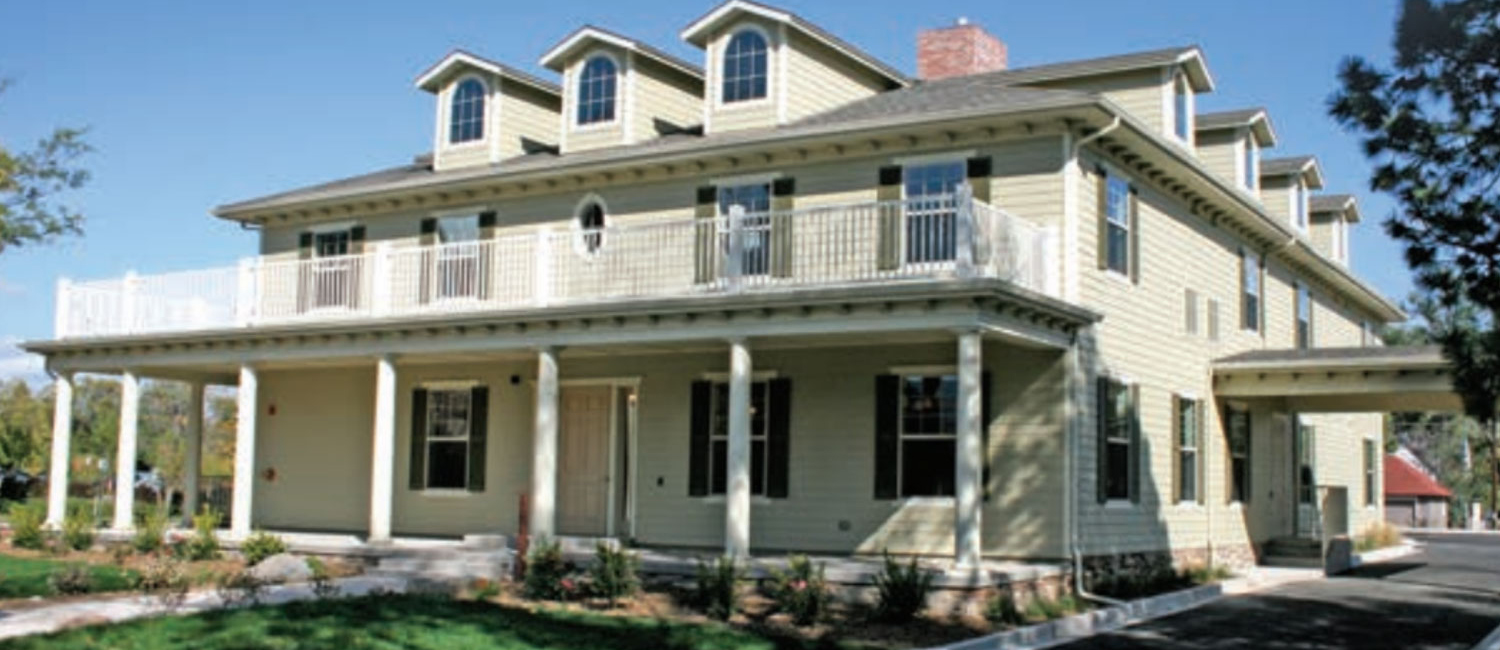 An exterior view of the John Zay guest house showing the front porch and dormered windows