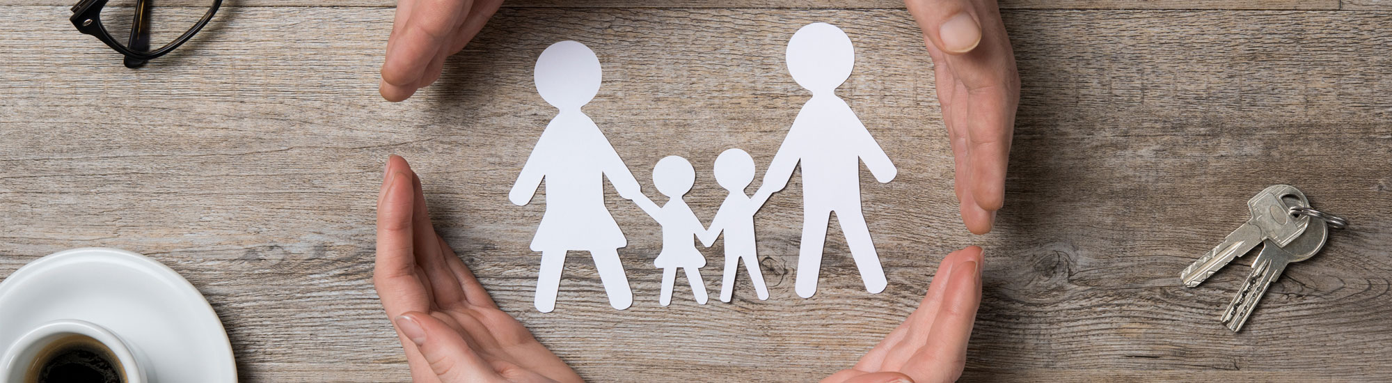 Paper cutout family on a table