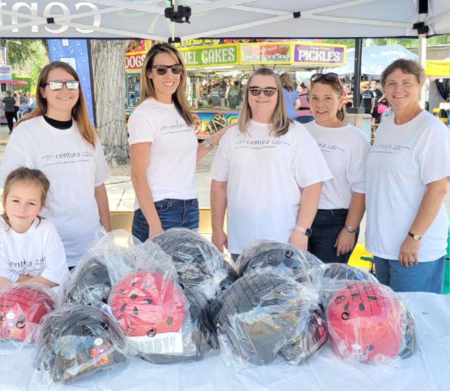 St. Mary-Corwin Hospital’s Trauma Services team distributing helmets.