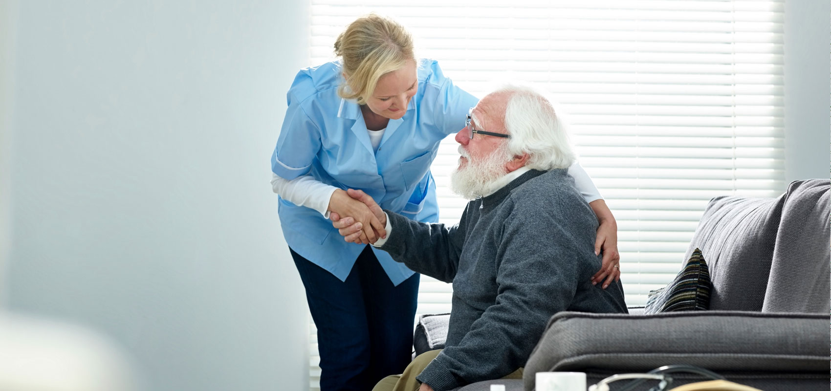 Provider helping a senior