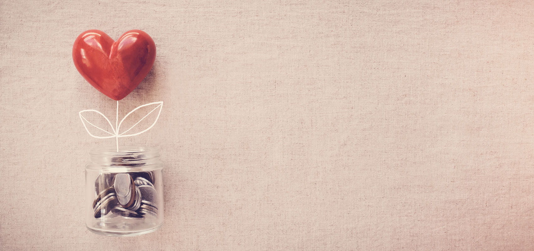 Jar with coins and heart