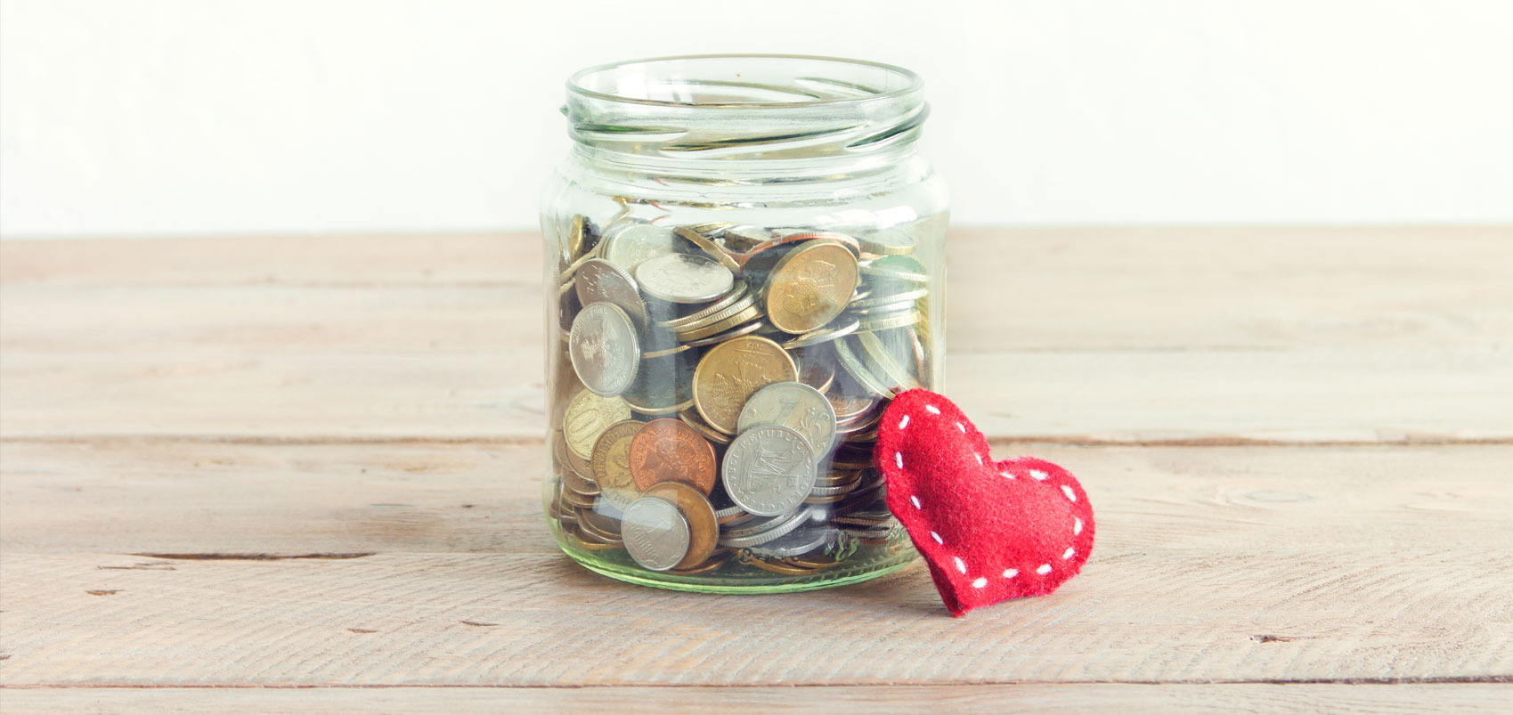 Jar with coins and heart Jar with coins and heart