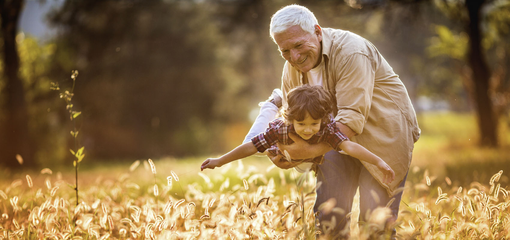 Grandpa holding grandson
